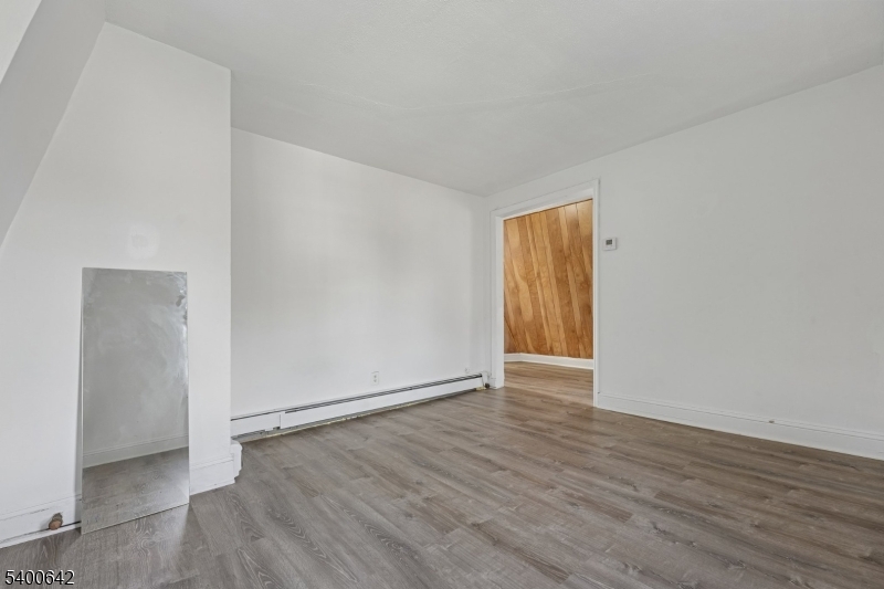 24 Franklin Place Summit, NJ 07901 - Photo 25 of 36 an empty room with wooden floor and closet