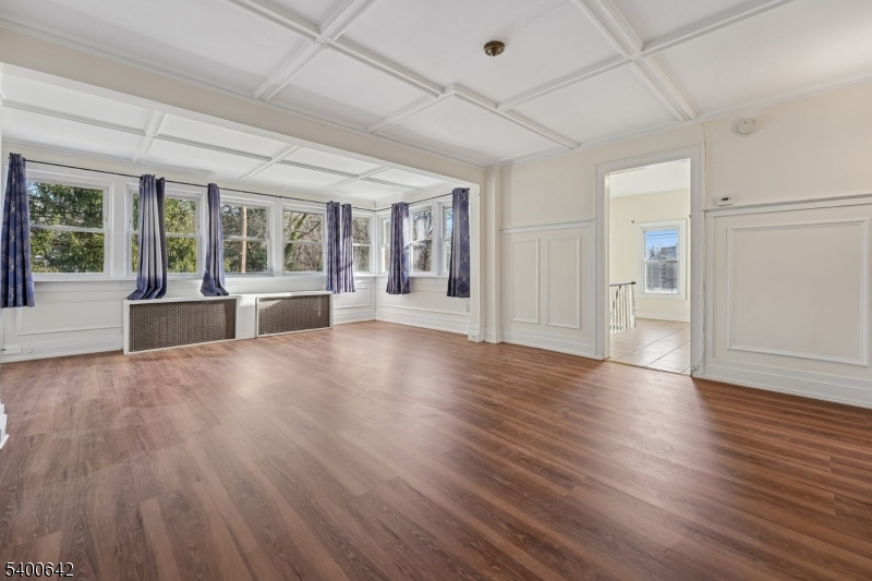 24 Franklin Place Summit, NJ 07901 - Photo 5 of 36 an empty room with wooden floor and windows