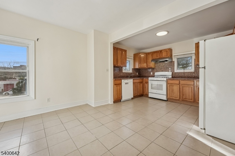 24 Franklin Place Summit, NJ 07901 - Photo 10 of 36 a kitchen with white cabinets appliances and a window