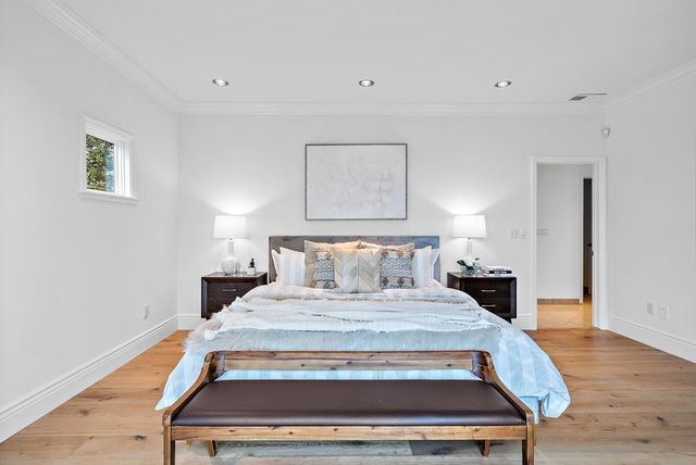 a view of balcony with wooden floor and fence