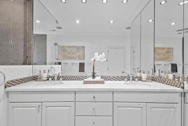 an aerial view of a house with a yard and large trees