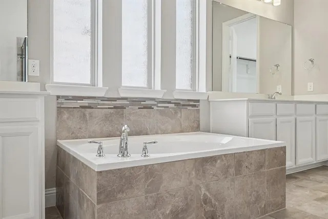 a bathroom with a sink and a window