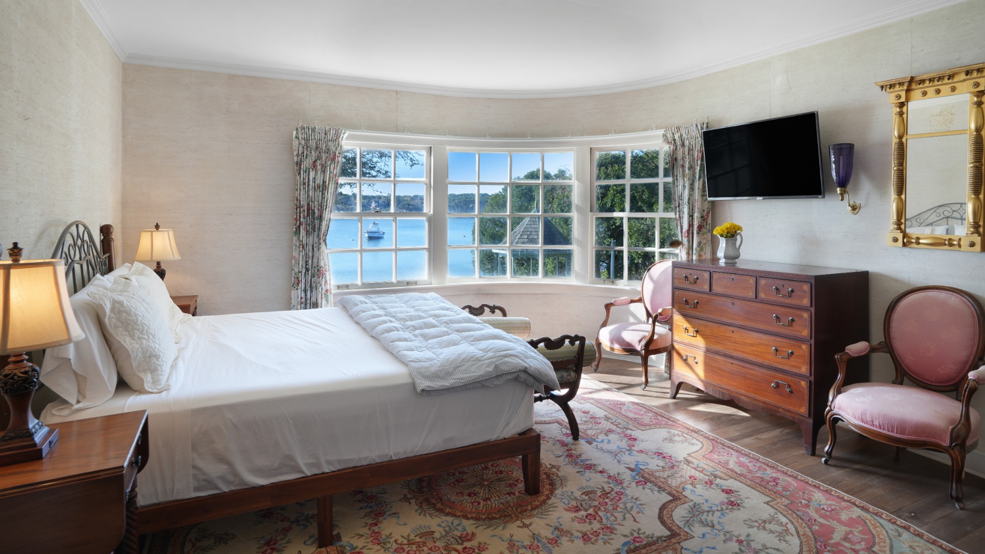 57 Hines Point Road Vineyard Haven, MA 02568 - Photo 17 of 29 a bedroom with a bed and a flat screen tv