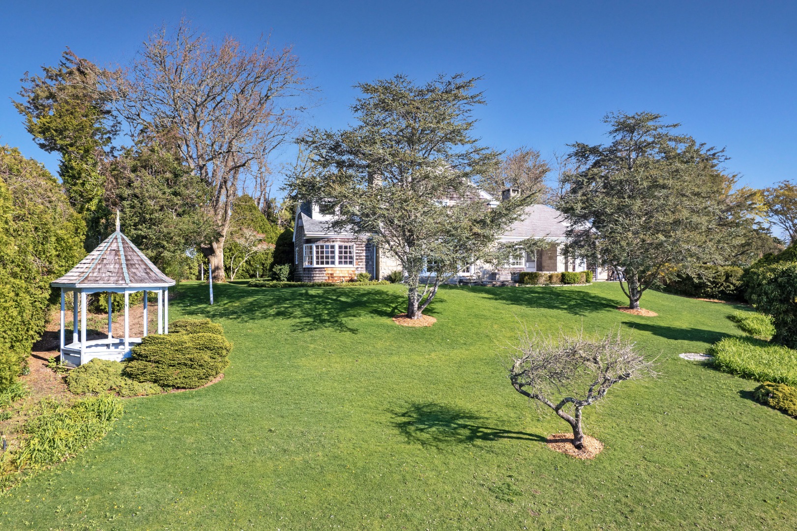 57 Hines Point Road Vineyard Haven, MA 02568 - Photo 23 of 29 a front view of a house with garden
