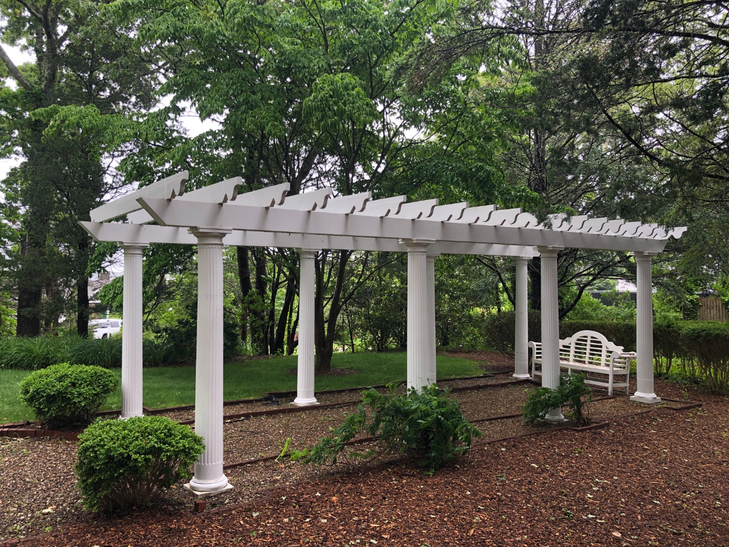 57 Hines Point Road Vineyard Haven, MA 02568 - Photo 28 of 29 a view of a patio with a table chairs and a backyard