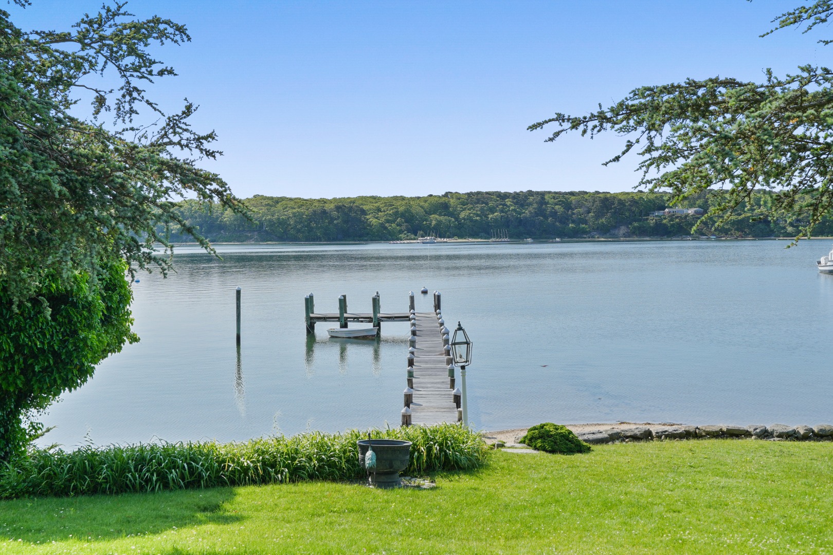 57 Hines Point Road Vineyard Haven, MA 02568 - Photo 3 of 29 a view of a lake with a yard