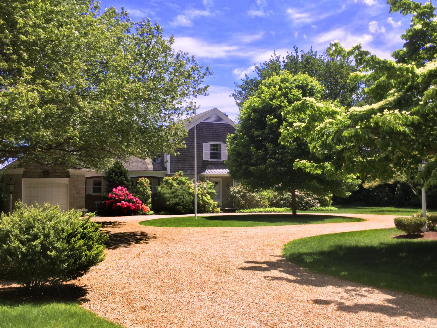 57 Hines Point Road Vineyard Haven, MA 02568 - Photo 9 of 29 a view of a garden with flowers and plants