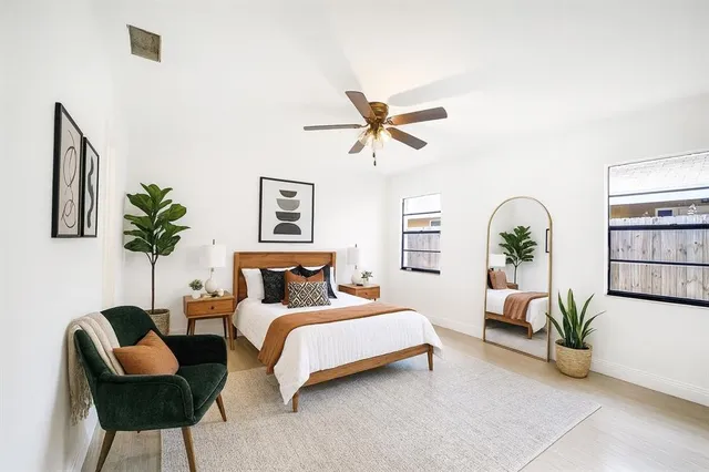 a bedroom with a bed and a couch