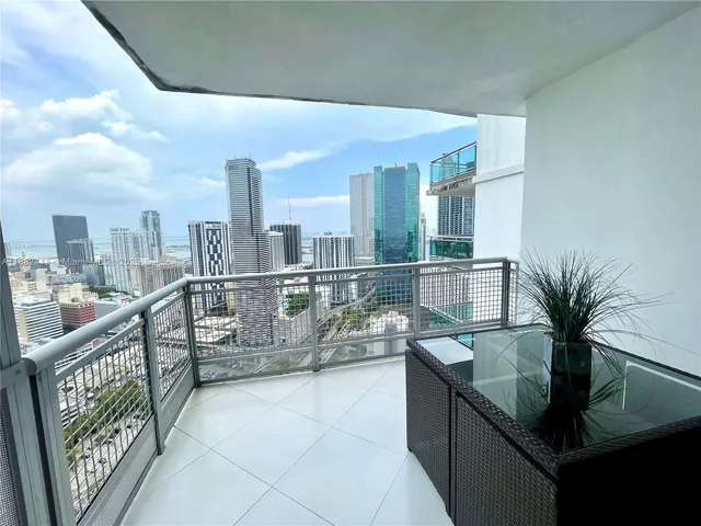 a kitchen with counter top space and wooden floor