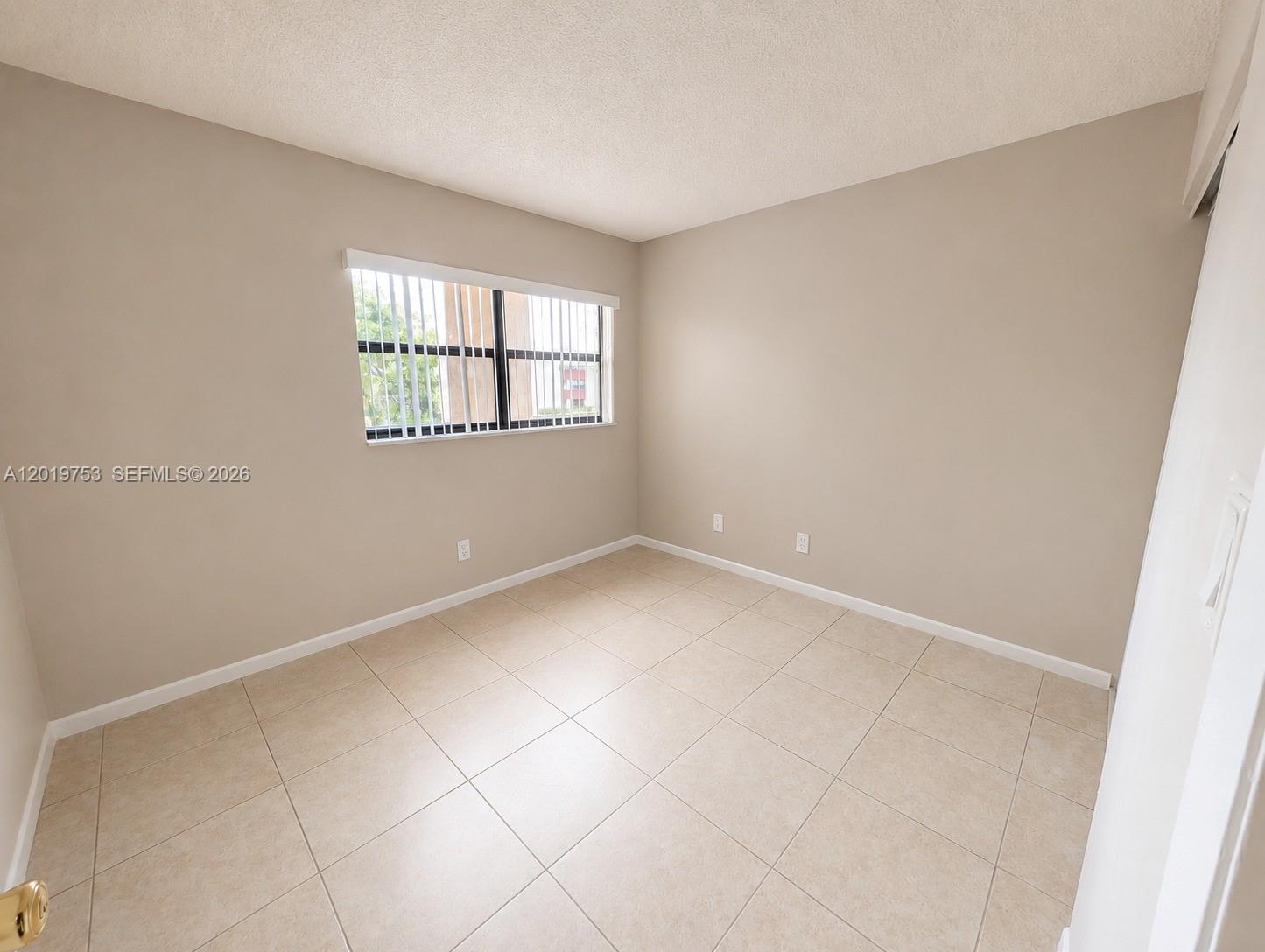 3410 Foxcroft Road, Unit 206 Miramar, FL 33025 - Photo 15 of 23 a view of an empty room with a window