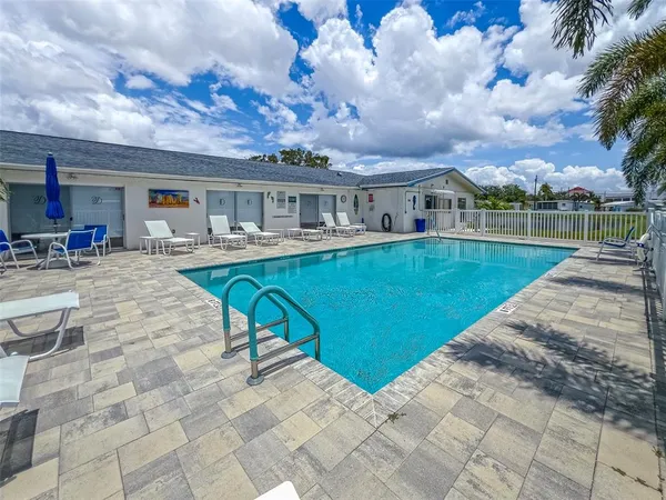 a view of a table and chairs in the garden