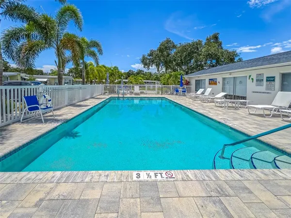 a view of a house with a yard and tree s