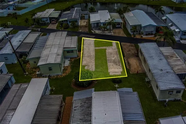an aerial view of a house with a big yard