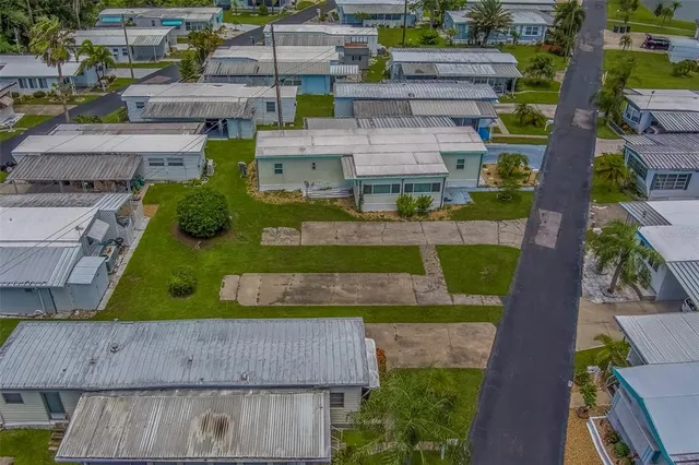 an aerial view of a house with a garden