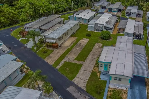 an aerial view of a house with a swimming pool