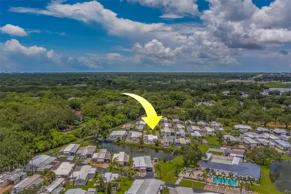 an aerial view of a house with a garden