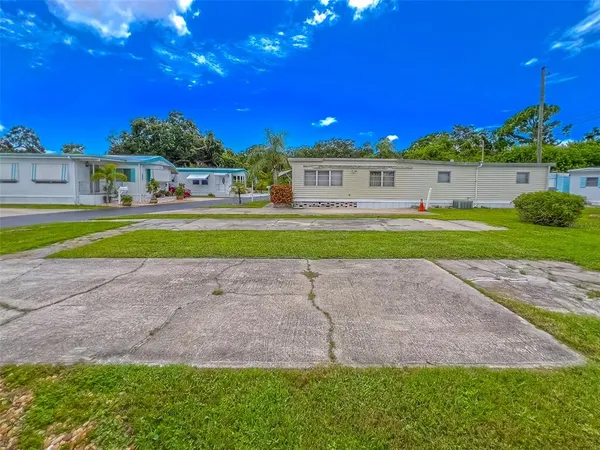 a view of a house with swimming pool