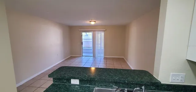 an entryway with wooden floor