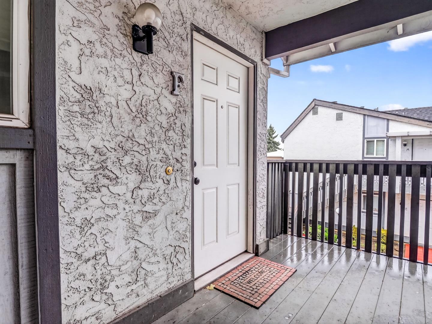 577 East Taylor Avenue, Unit F Sunnyvale, CA 94085 - Photo 5 of 7 a view of a wooden door and a window