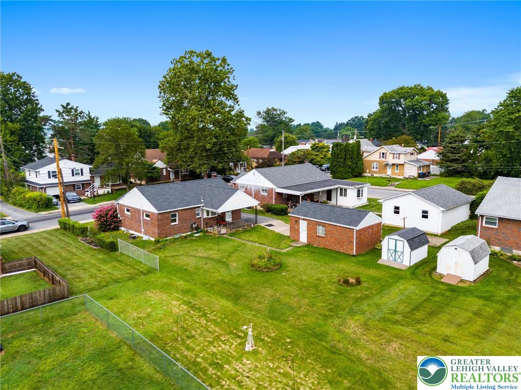 515 Franklin Street Emmaus, PA 18049 - Photo 14 of 45 a aerial view of a house with swimming pool and trees in the background