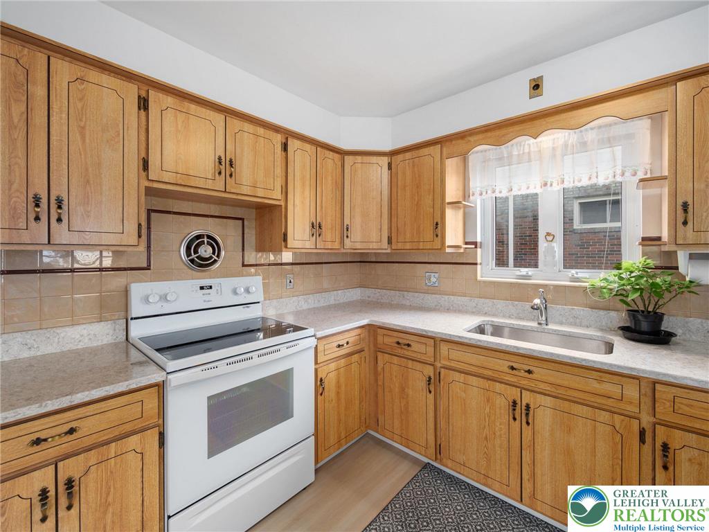 515 Franklin Street Emmaus, PA 18049 - Photo 26 of 45 a kitchen with cabinets appliances and a sink