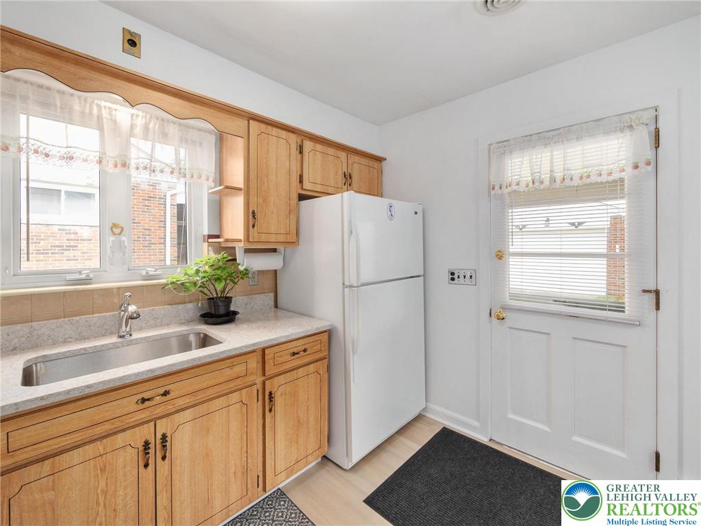 515 Franklin Street Emmaus, PA 18049 - Photo 27 of 45 a kitchen with a refrigerator and a sink
