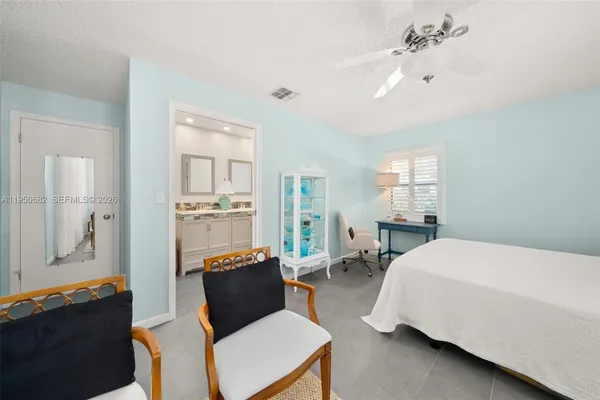 a bedroom with a bed and furniture