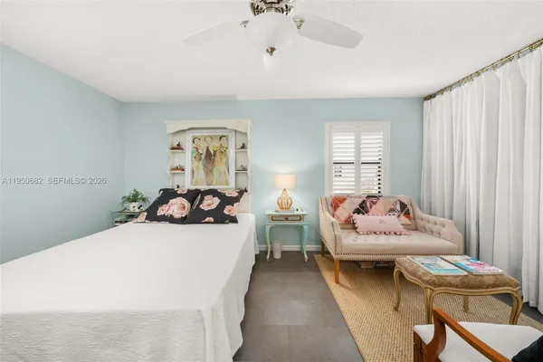 a bedroom with a bed and furniture
