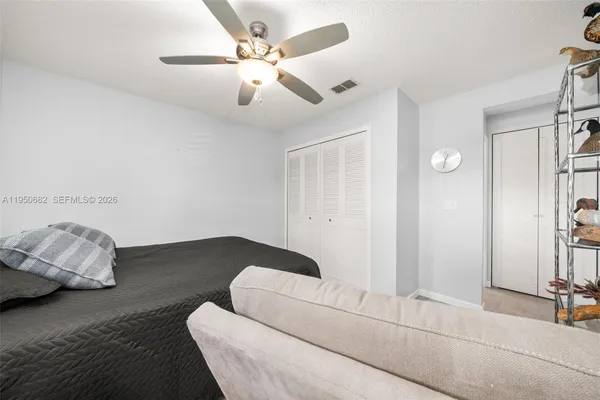 a bedroom with furniture and wooden floor