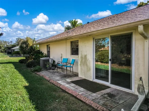 a view of a backyard with a patio