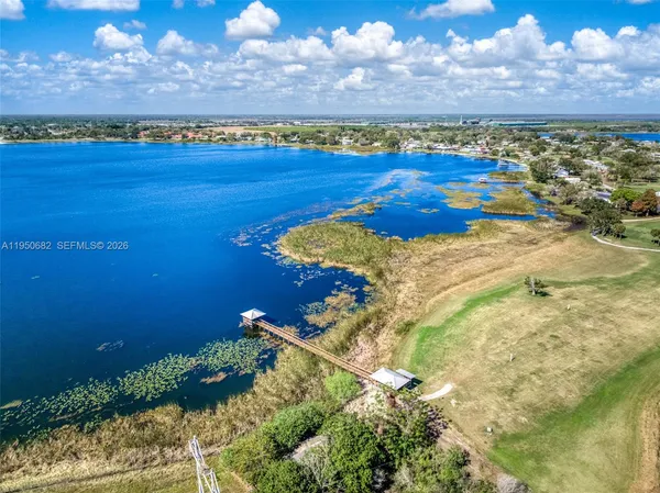 a view of a lake in front of house with outdoor space