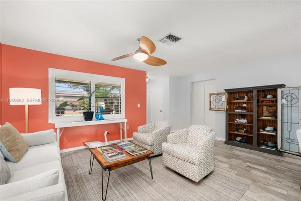 a living room with furniture and a window