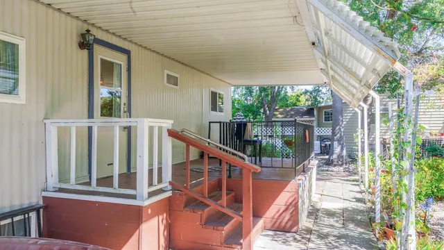 a view of balcony with wooden floor