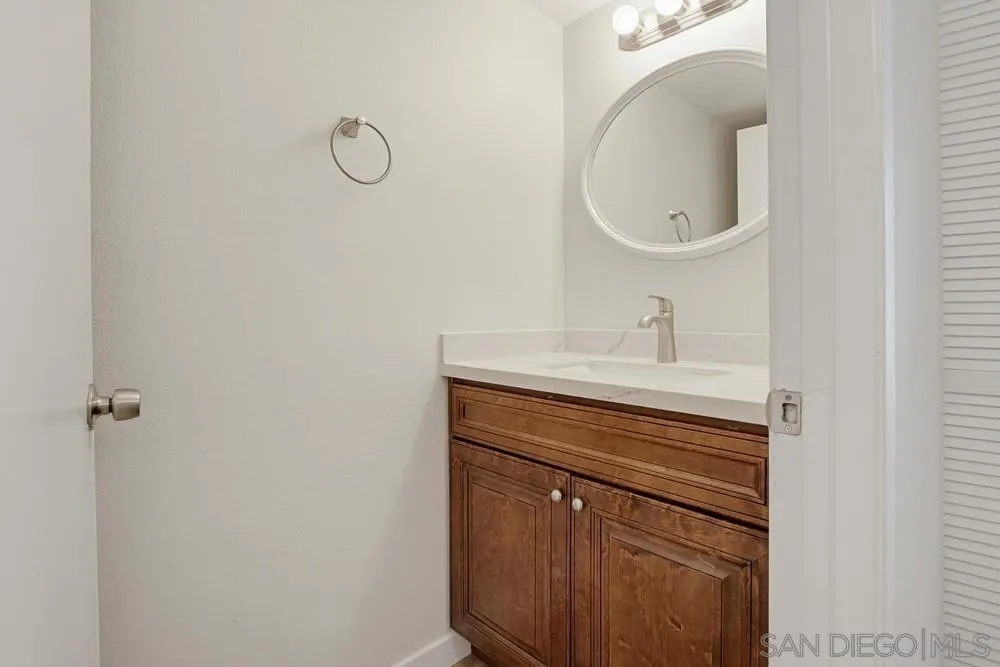 5130 North River Road, Unit B Oceanside, CA 92057 - Photo 23 of 51 a bathroom with a sink vanity and toilet