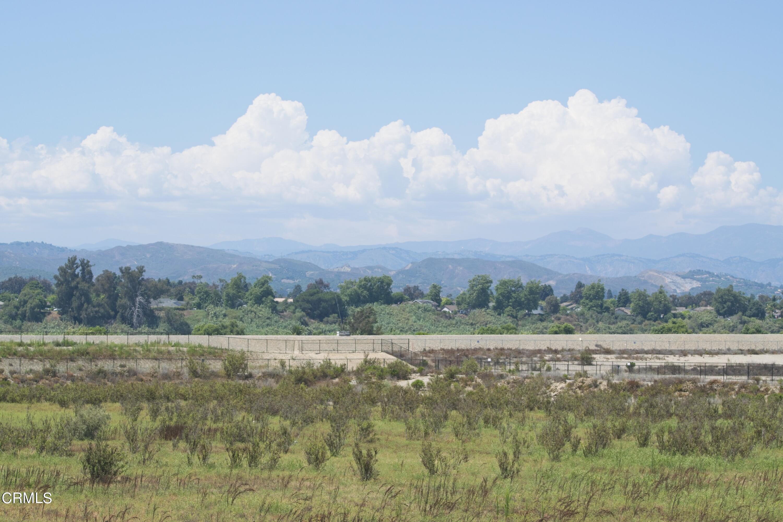 543 Xanadu Way Oxnard, CA 93036 - Photo 12 of 19 a view of a field with trees in the background