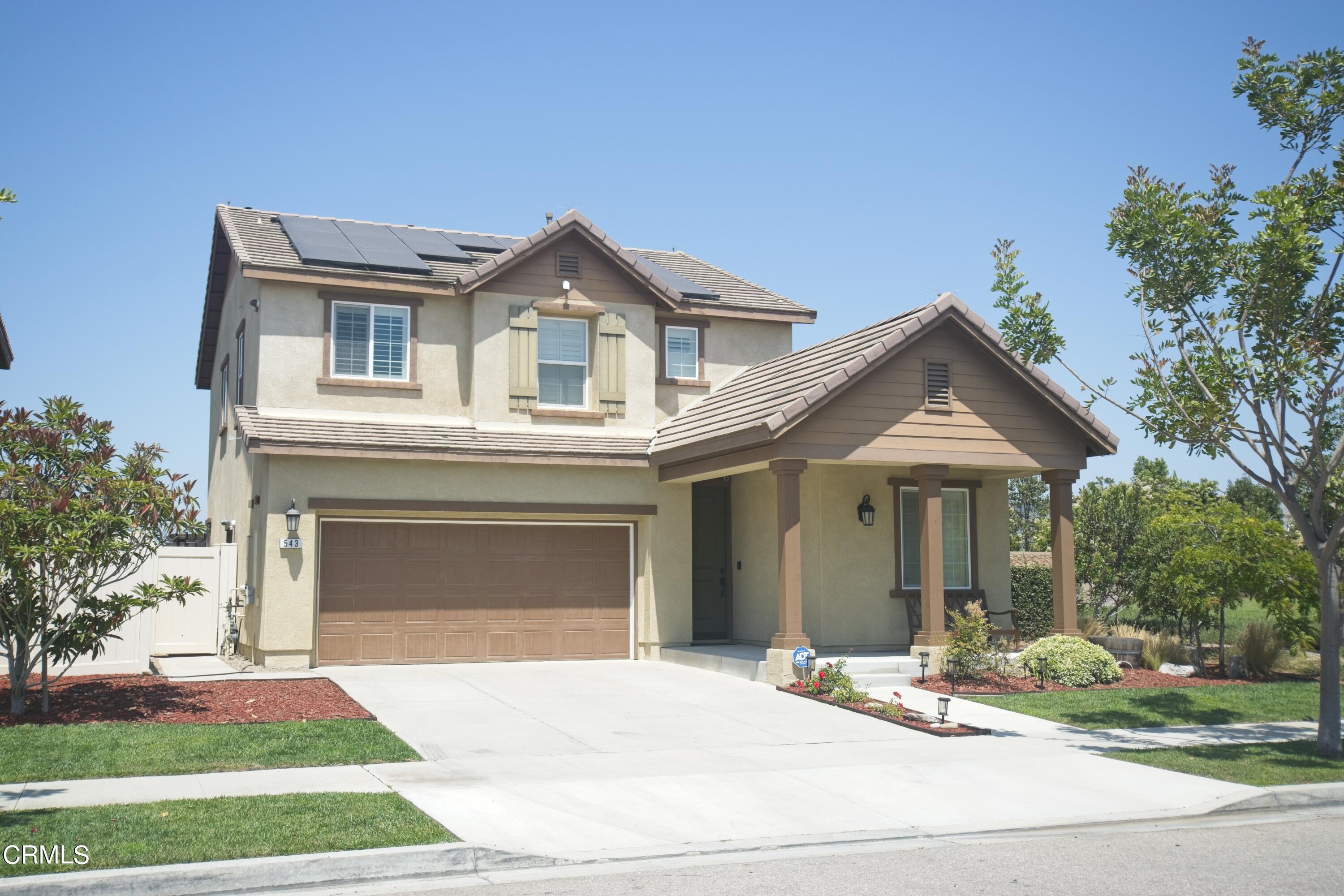 543 Xanadu Way Oxnard, CA 93036 - Photo 3 of 19 a front view of a house with a yard