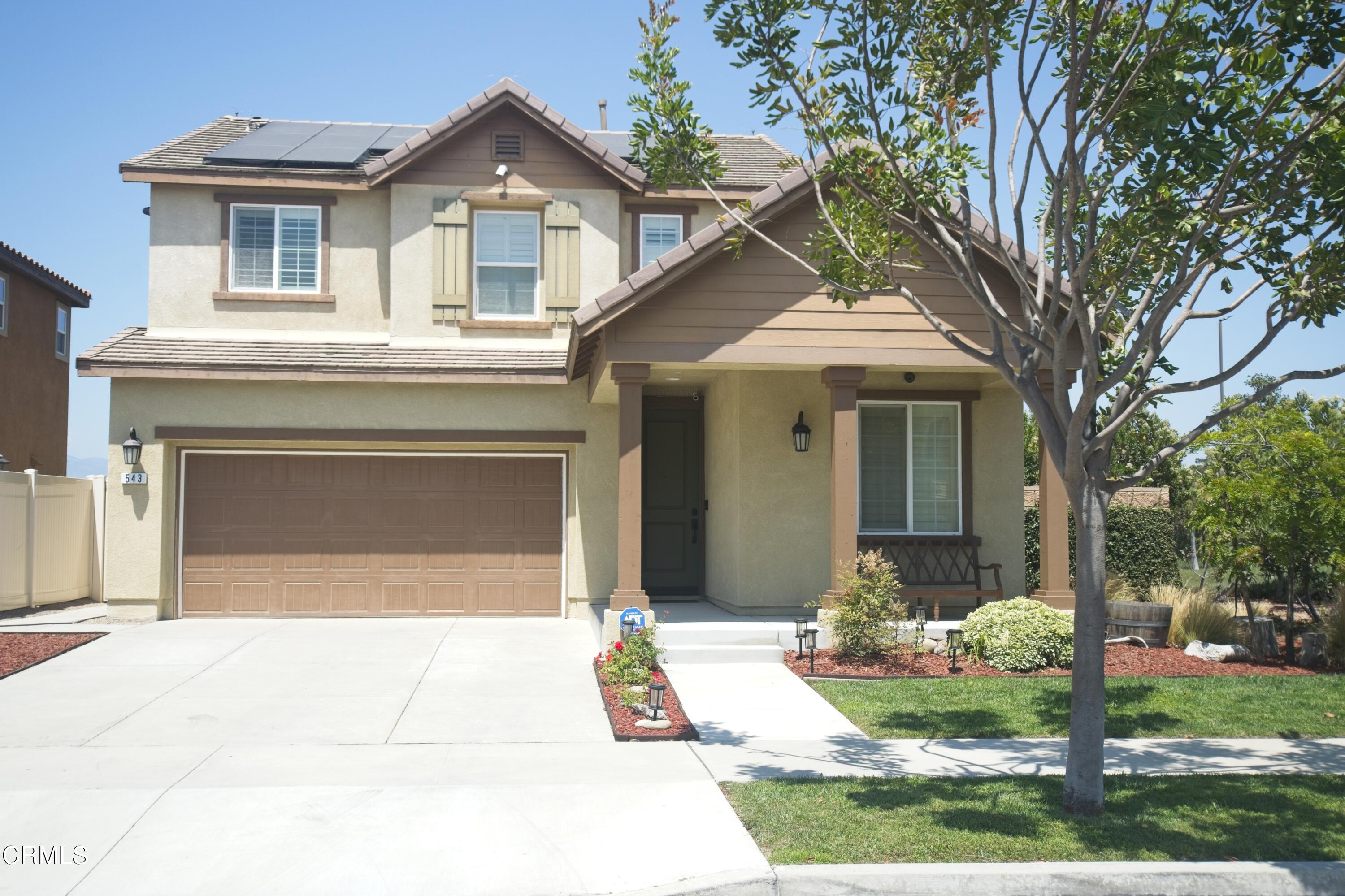 543 Xanadu Way Oxnard, CA 93036 - Photo 4 of 19 a front view of a house with a yard