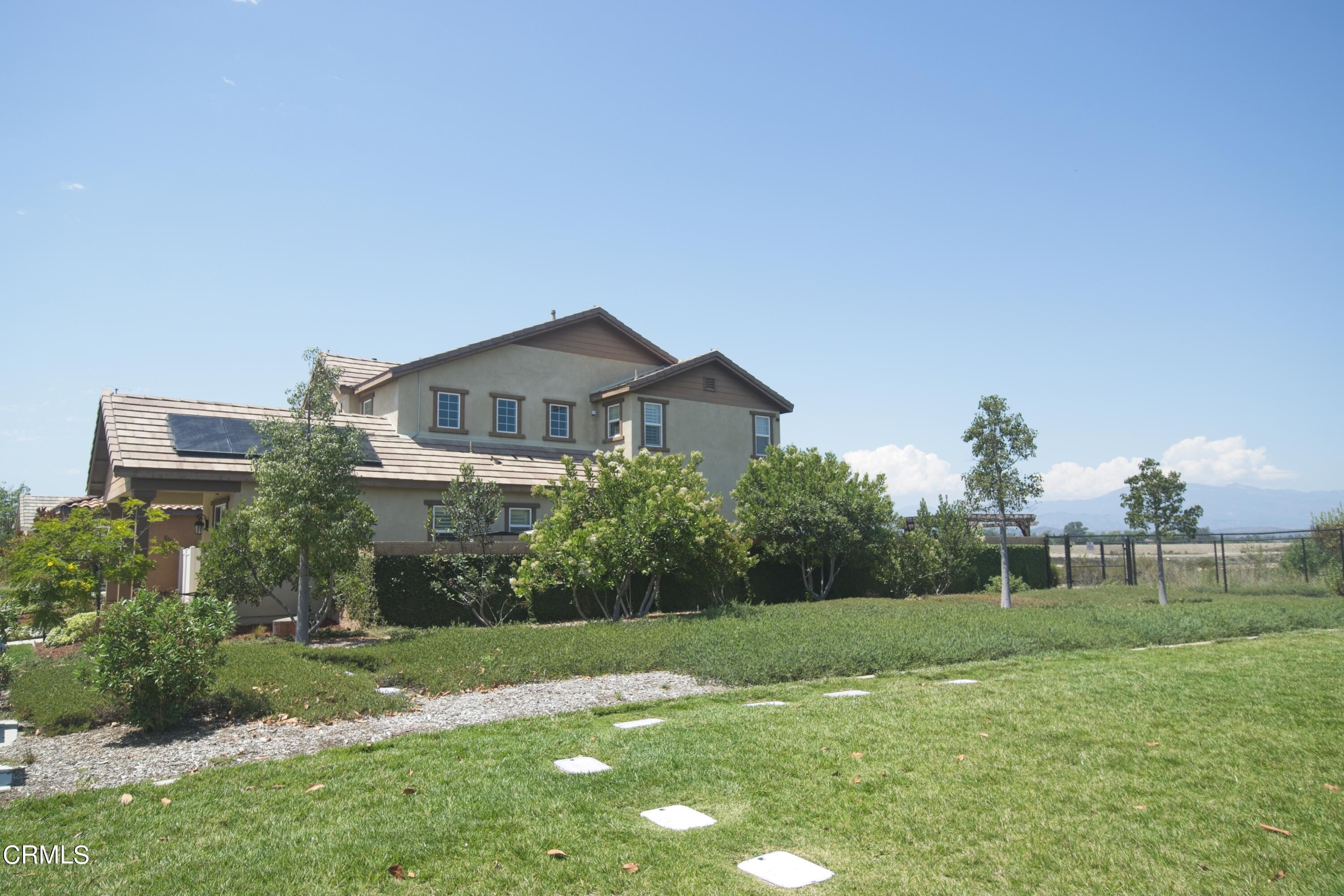543 Xanadu Way Oxnard, CA 93036 - Photo 5 of 19 a front view of a house with garden