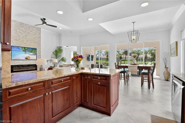 a kitchen with lots of counter top space and dining table