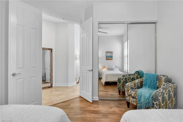 a bedroom with a bed and a couch