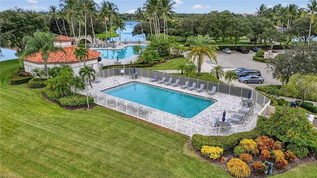a view of a swimming pool with a patio and a garden