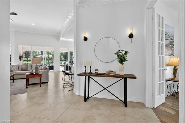 a living room with furniture and a mirror