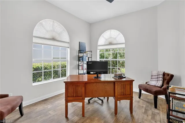 a workspace with furniture and a window