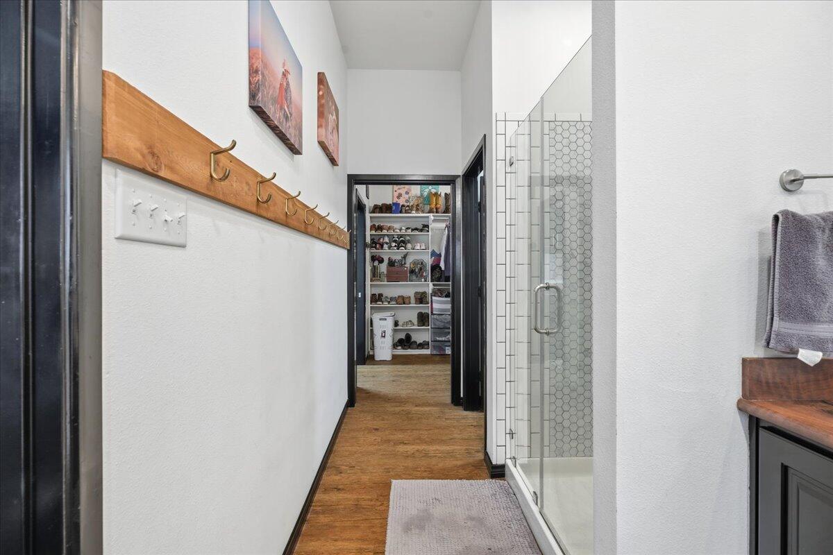 3013 111th Street Lubbock, TX 79423 - Photo 22 of 37 a view of a hallway with wooden shelves