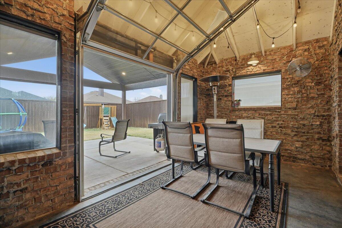3013 111th Street Lubbock, TX 79423 - Photo 33 of 37 a patio with table and chairs