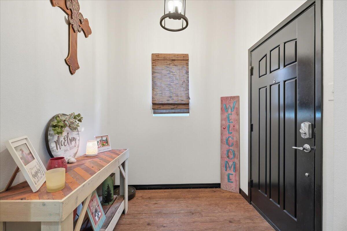 3013 111th Street Lubbock, TX 79423 - Photo 4 of 37 a view of an entryway with wooden floor