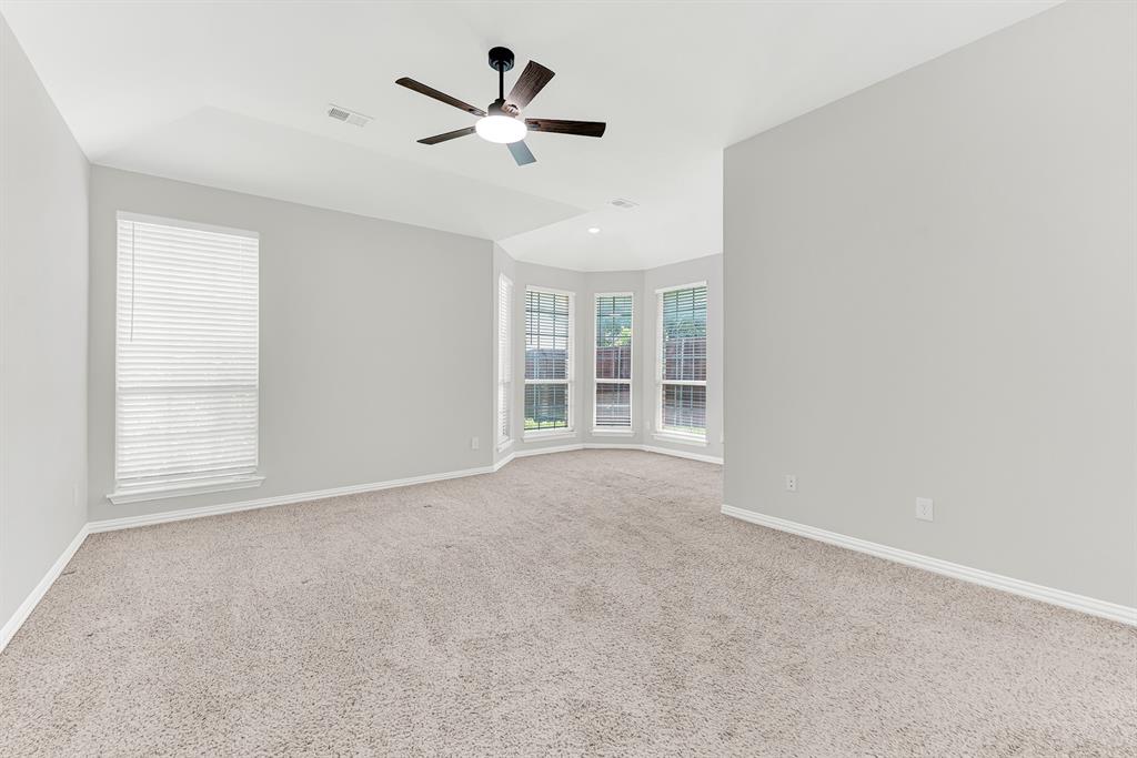 3500 Neiman Road Plano, TX 75025 - Photo 16 of 26 More plush carpeting in the primary bedroom! Large sunny windows overlook the backyard and the cozy bay window is perfect for a quiet reading nook, or a soothing and stress-free place for yoga or meditation.
