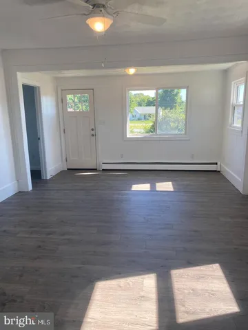 a view of an empty room and window