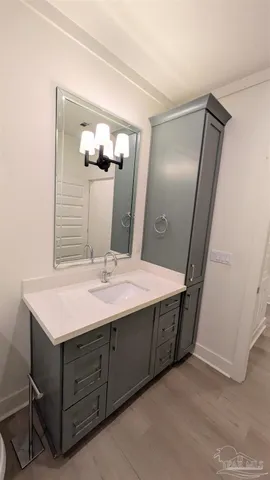 a bathroom with a double vanity sink and mirror