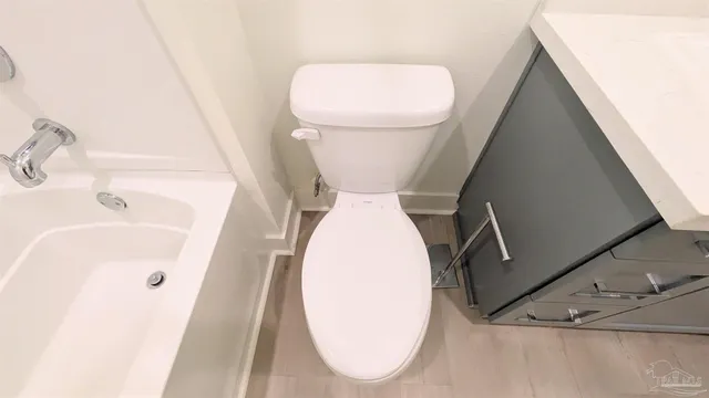 a bathroom with a sink and toilet